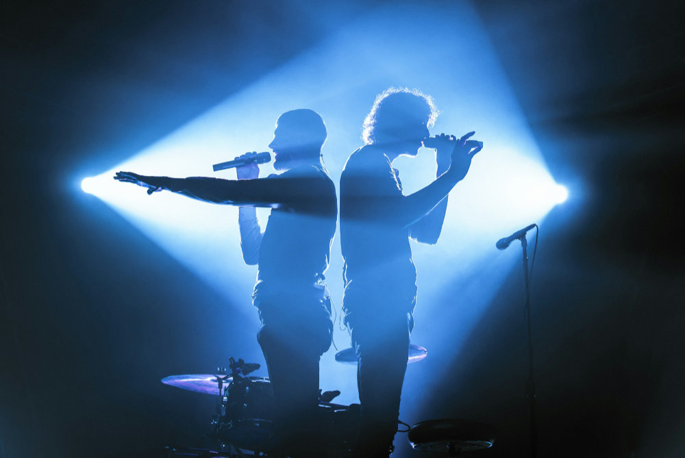 two singers on stage
